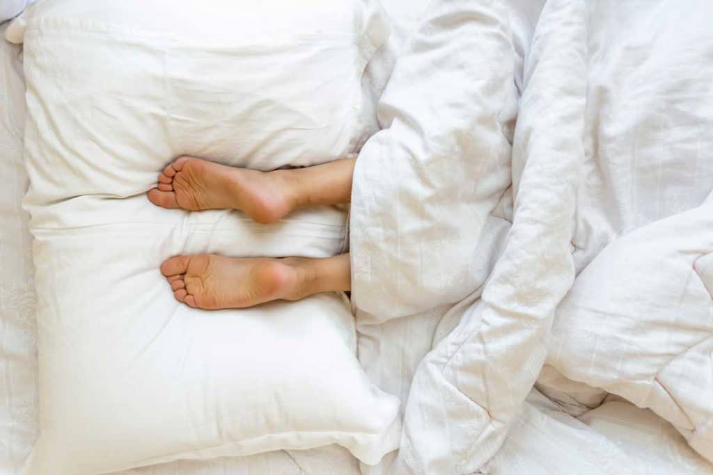 Why People Sleep With Legs Up Anyway? - SOLACE SLEEP