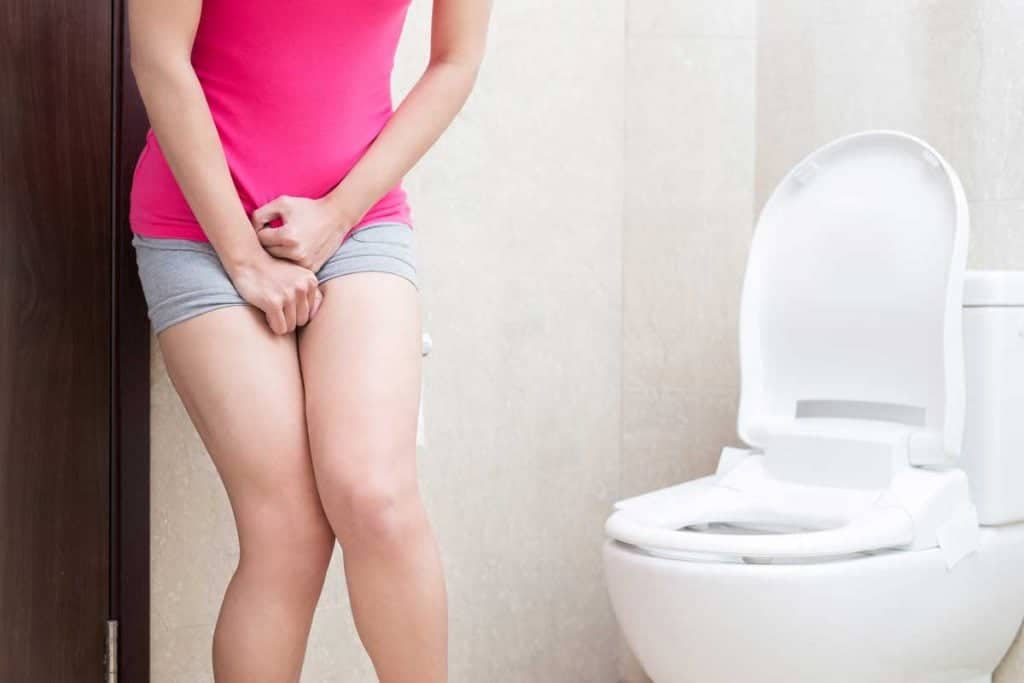 woman urgently peeing
