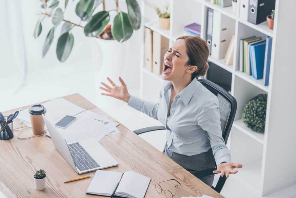 woman stressed out at work and is shouting