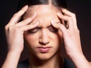 Girl having a headache and migraine